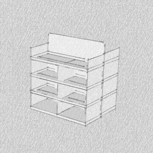 A person sketching out packaging ideas on a whiteboard in a workshop.