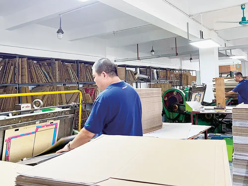 A factory production line for corrugated packaging.