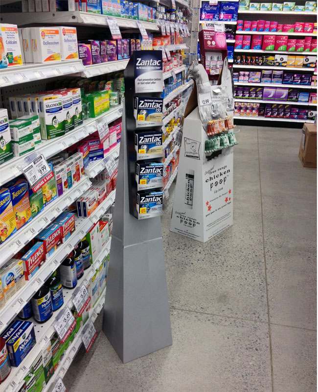A shopper looking at an endcap display in a grocery store