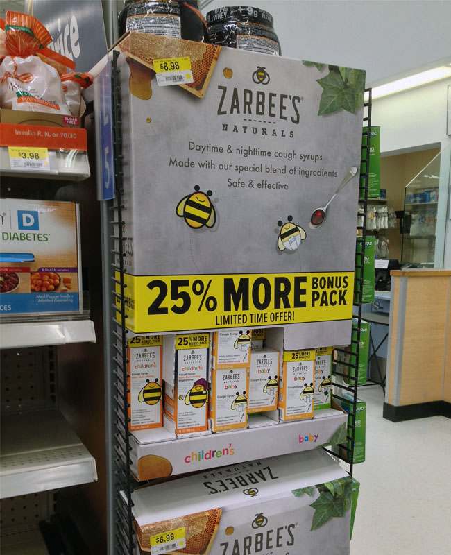 A colorful point of sale display in a busy retail aisle