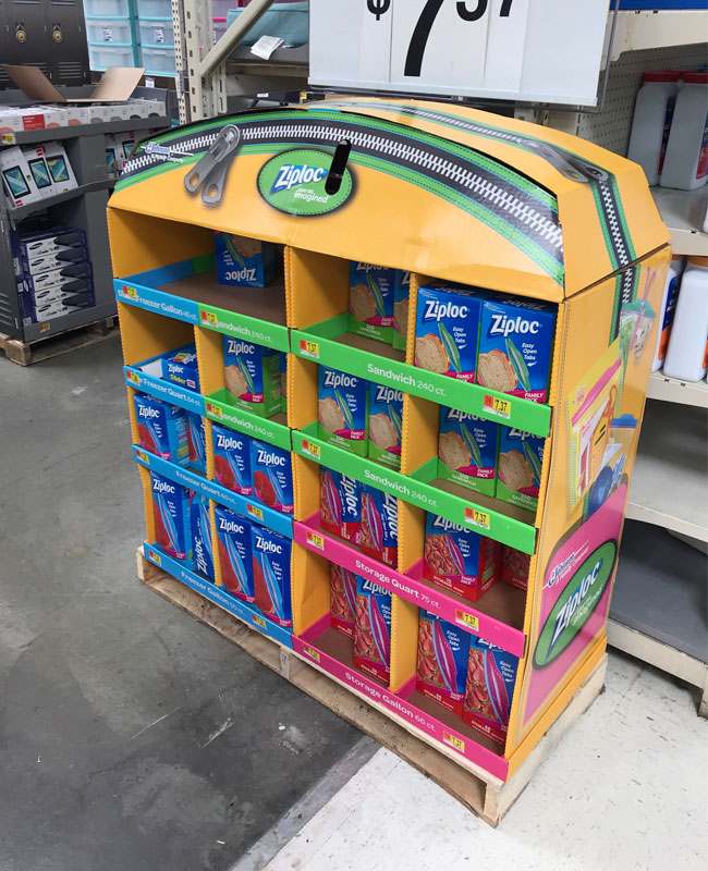 Custom Cardboard Display with Strong Branding A vibrant, custom-designed cardboard display showcasing a product's benefits.