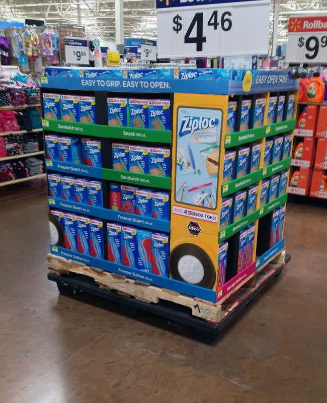 Cardboard Floor Display in Store A large, colorful floor display at the end of an aisle in Walmart.